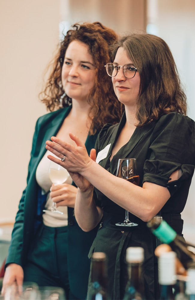 Professional Portrait Photographer in Melbourne captures two women at an event.